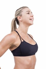 Obraz premium Female athlete posing with hands on hip