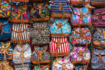 Fototapeta premium group of colors bags in an european street market