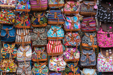 Fototapeta na wymiar group of colors bags in an european street market
