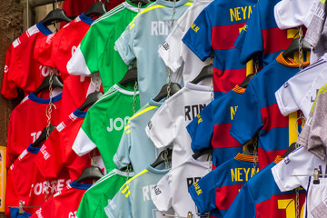 group of soccer shirts in an european street market