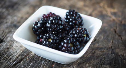 Blackberries on a wooden background