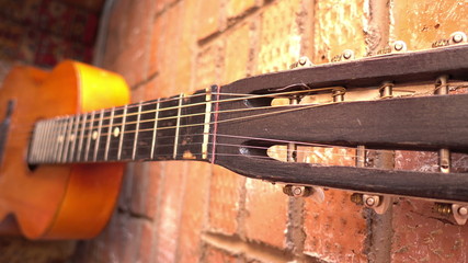 close guitar fretboard and strings