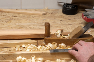 carpenter working,hammer,meter and screw-driver on construction