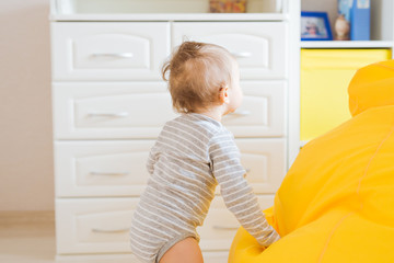 child and toddler concept - curious baby in the room