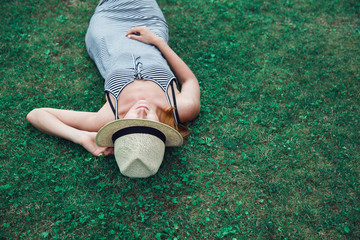 Trendy Hipster Girl Relaxing on the Grass