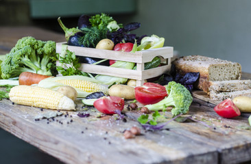 Rye bread with vegetables and spices on a wooden table