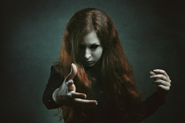 Scary witch with demon eyes