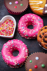 Colorful donuts on a grunge rusty table