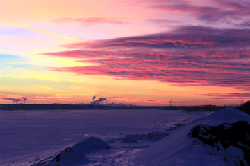 red sunset over the winter river