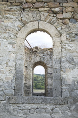 Obraz na płótnie Canvas Old stone arc window in the window, , ruin of church, Bulgaria