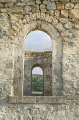 Old stone arc window in the window, , ruin of church, Bulgaria