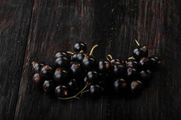black currants on wooden background