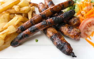 Grilled sausage served with french fries