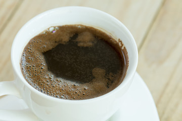 Closeup macro view cup of black coffee