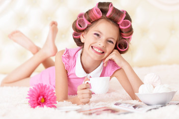 Little pretty girl   in hair curlers 