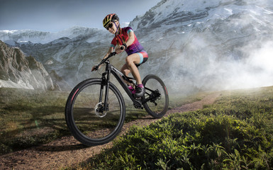 Naklejka na ściany i meble Sport. Mountain Bike cyclist riding single track.