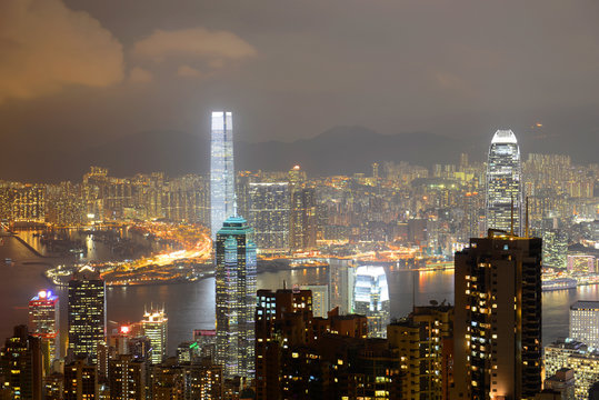 Hong Kong Skyline and Victoria Harbour at night from Victoria Peak on Hong Kong Island.