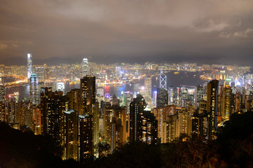 Hong Kong Skyline and Victoria Harbour at night from Victoria Peak on Hong Kong Island.
