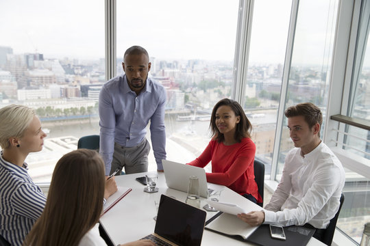 Business colleague discussing with each other in office