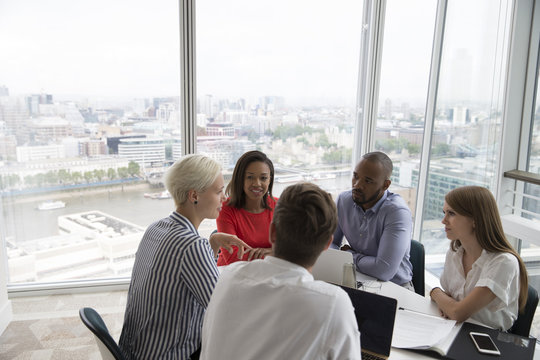 Group Of Five Business People Meeting In High Rise Office