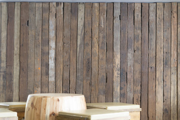 stool beside wooden board wall