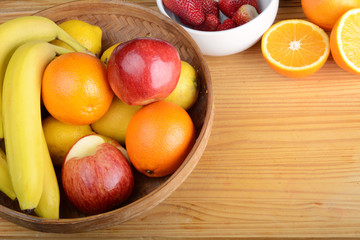 Naklejka na ściany i meble fresh fruits on wooden table. Healthy eating concept