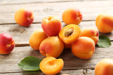 Naklejka na ściany i meble Ripe apricots fruit on grey wooden table