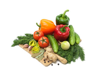 Fototapeta na wymiar Fresh vegetables and herbs on a cutting board.