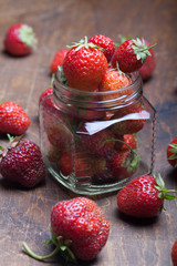 Lots of fresh bright red strawberries. Selective focus. Shallow