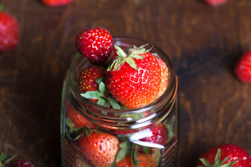 Lots of fresh bright red strawberries. Selective focus. Shallow