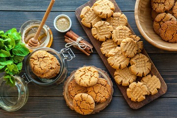 peanut butter and honey cookies on a dark wood background. selective focus