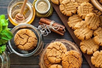 peanut butter and honey cookies on a dark wood background. selective focus