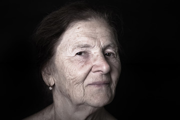 Portrait of elderly woman. Dreaminess. Toned