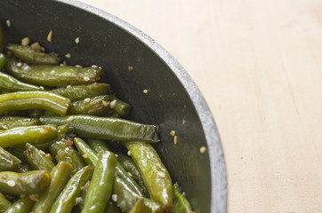 Fried green beans with garlic and sesame. Juicy food background