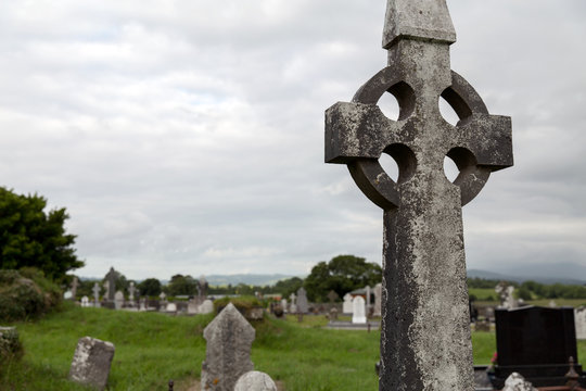 old grave cross on celtic cemetery in ireland