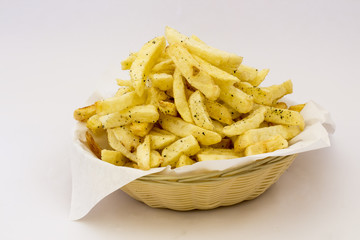 Potatoes fries in the plate isolated on white.