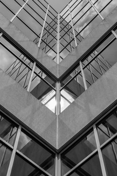 Urban Geometry, looking up to building. Modern architecture black and white, concrete and glass.  Abstract architectural design. Inspirational, artistic image BW. Artistic image and point of view.