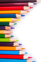 Fototapeta premium Colored pencils isolated on a white background closeup