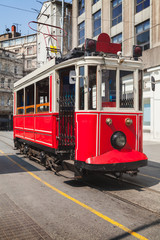 Fototapeta na wymiar Old red tram goes on Istiklal street
