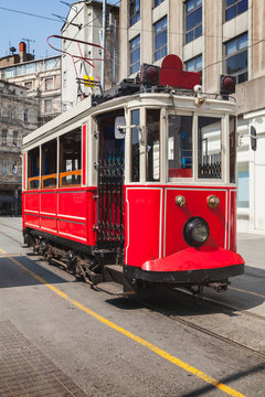 Old red tram goes on Istiklal street