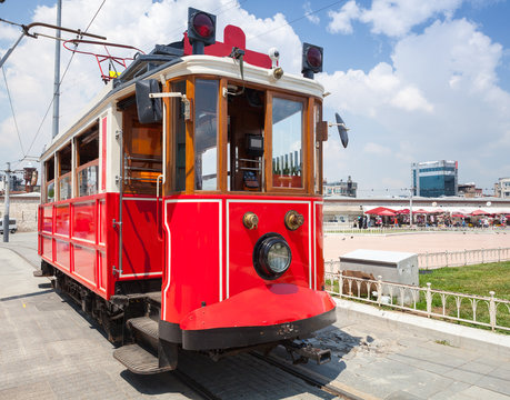 Old red tram goes on Taksim square
