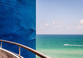 Abstract image from balcony terrace of apartment with view of ocean. Tropical view from hotel condo with view of beach. Minimal design. Abstract architecture. 