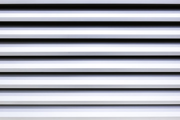 The galvanized wall of the factory building.Close-up of the pattern of building in back and white tone.