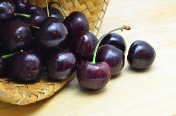 Fresh and sweet cherry in weave basket