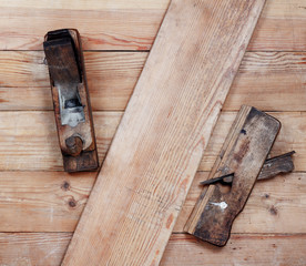 Two old planer on wooden boards. Top view