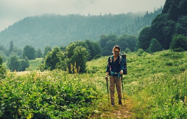 Female hiker walking in mountains