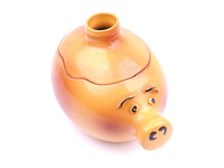 Pot for baking in the form of a pig on a white background