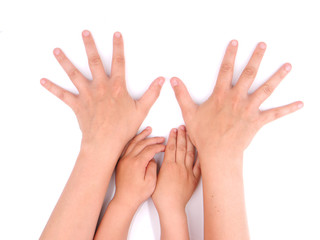 hands child and mother on a white background