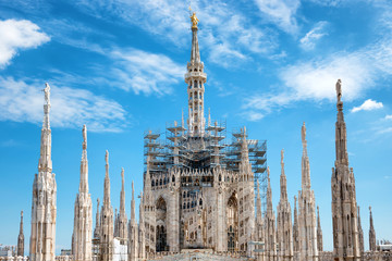 Fototapeta premium Statues on the roof of famous Milan Cathedral Duomo