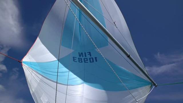 The wind blew up spinnaker at the bow of yacht